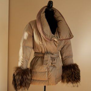 A medium length puffer jacket with fur cuff